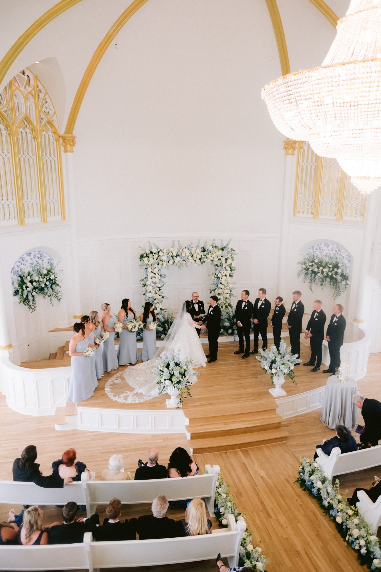 Bride walking the aisle of the historic Kansas City chapel